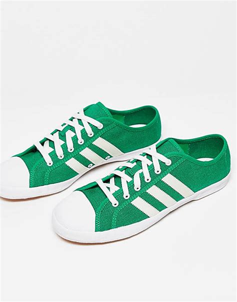 adidas Originals Adria trainers in white and green